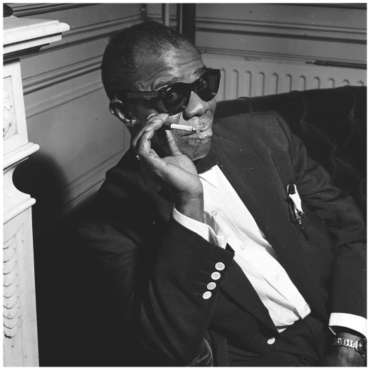 Louis Armstrong smoking